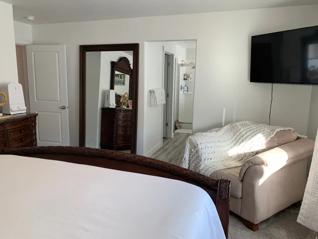 Recessed lighting and a wall-mounted flat-screen television