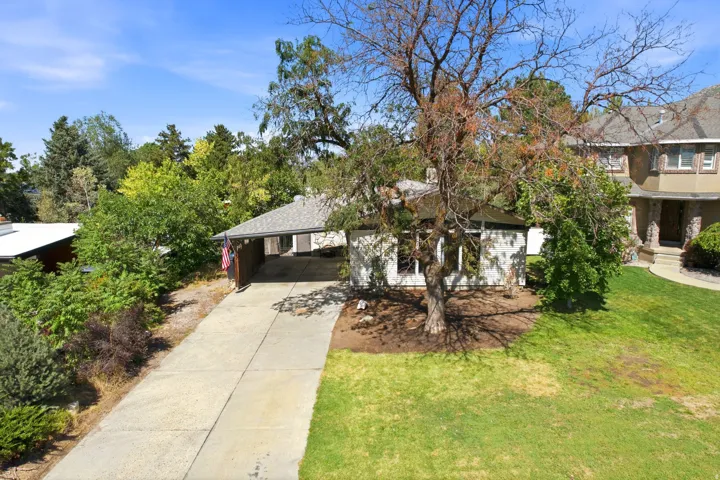 Driveway leading to covered carport