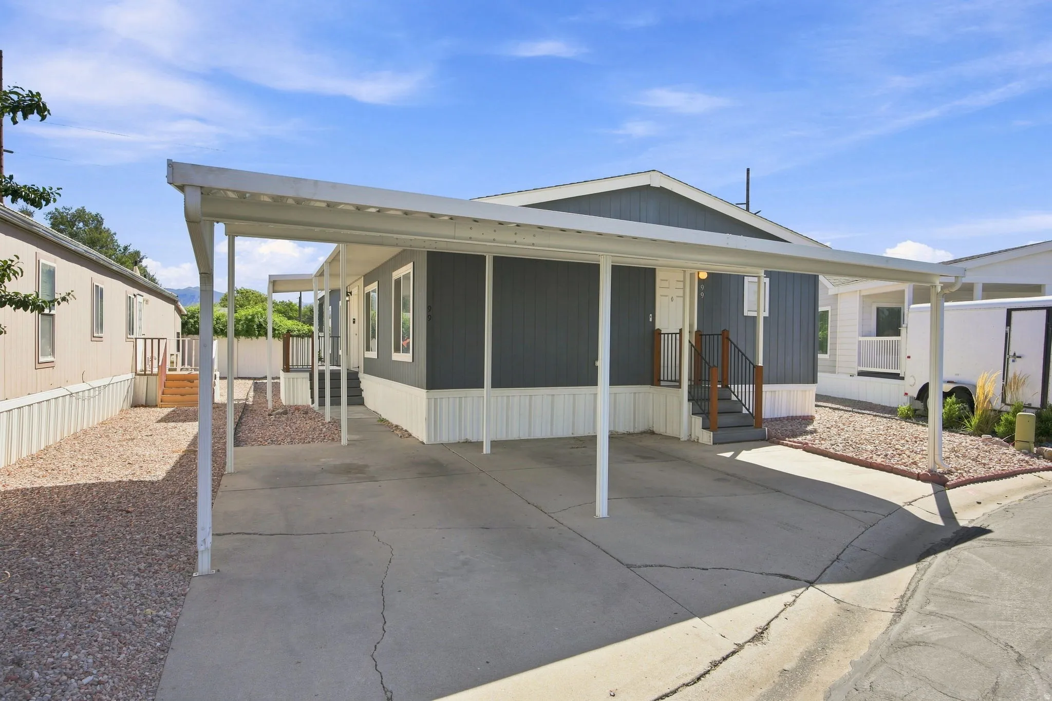 Covered carport and a dedicated gravel side yard