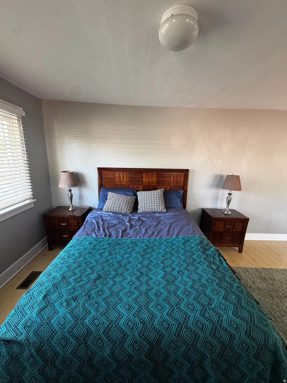 Wood-finish flooring, recessed ceiling lighting, and window blinds