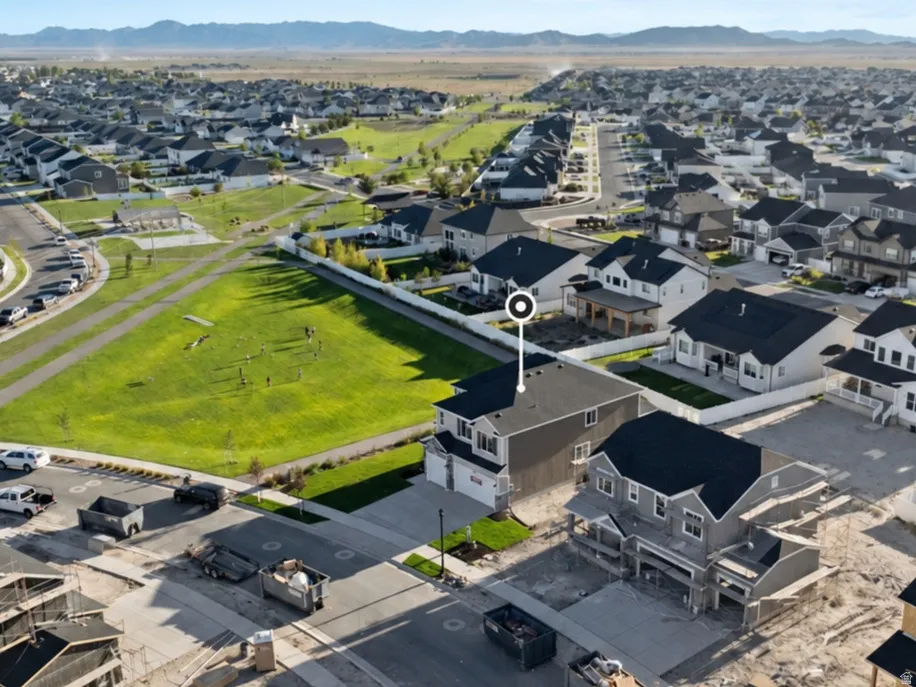 Aerial view of a residential community with distant mountains