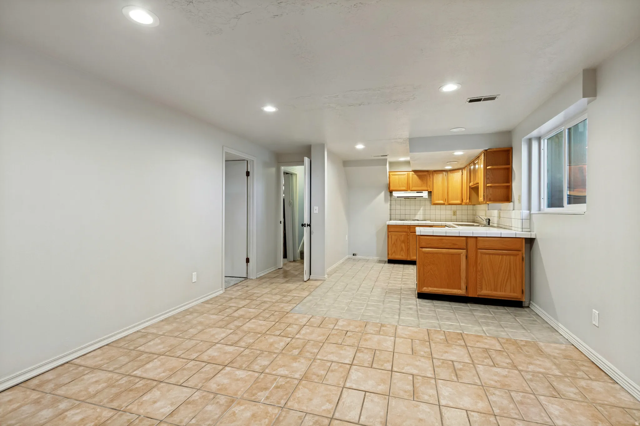 ADU - Open-concept room featuring recessed lighting, tile flooring, and light-toned walls