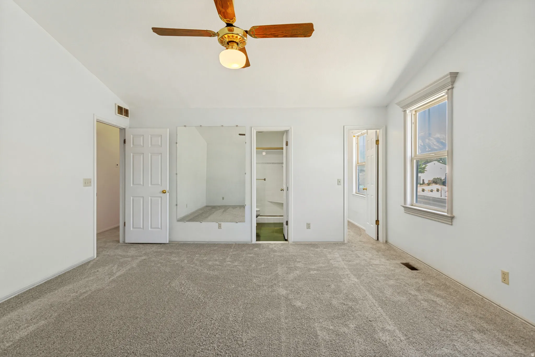 Primary Bedroom -  Room with carpeted flooring, a ceiling fan, and a trimmed window