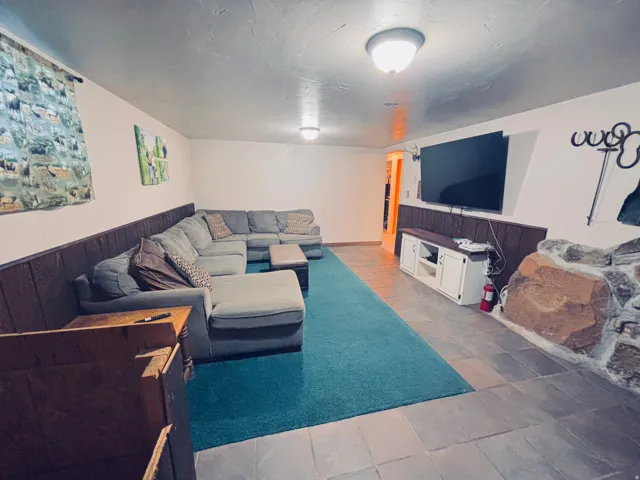 Downstairs family room with huge fireplace
