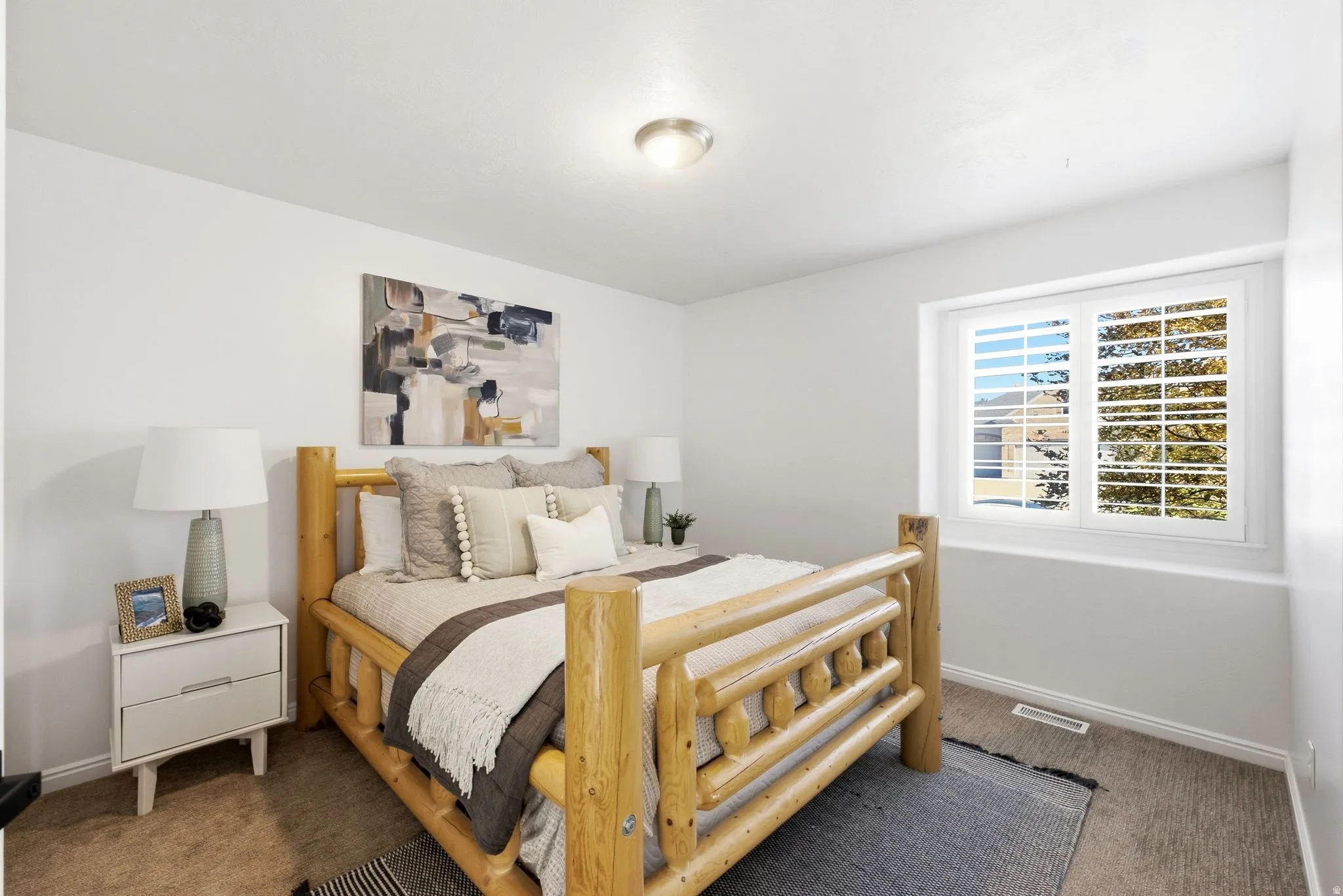 Bright room with neutral wall color and carpet flooring