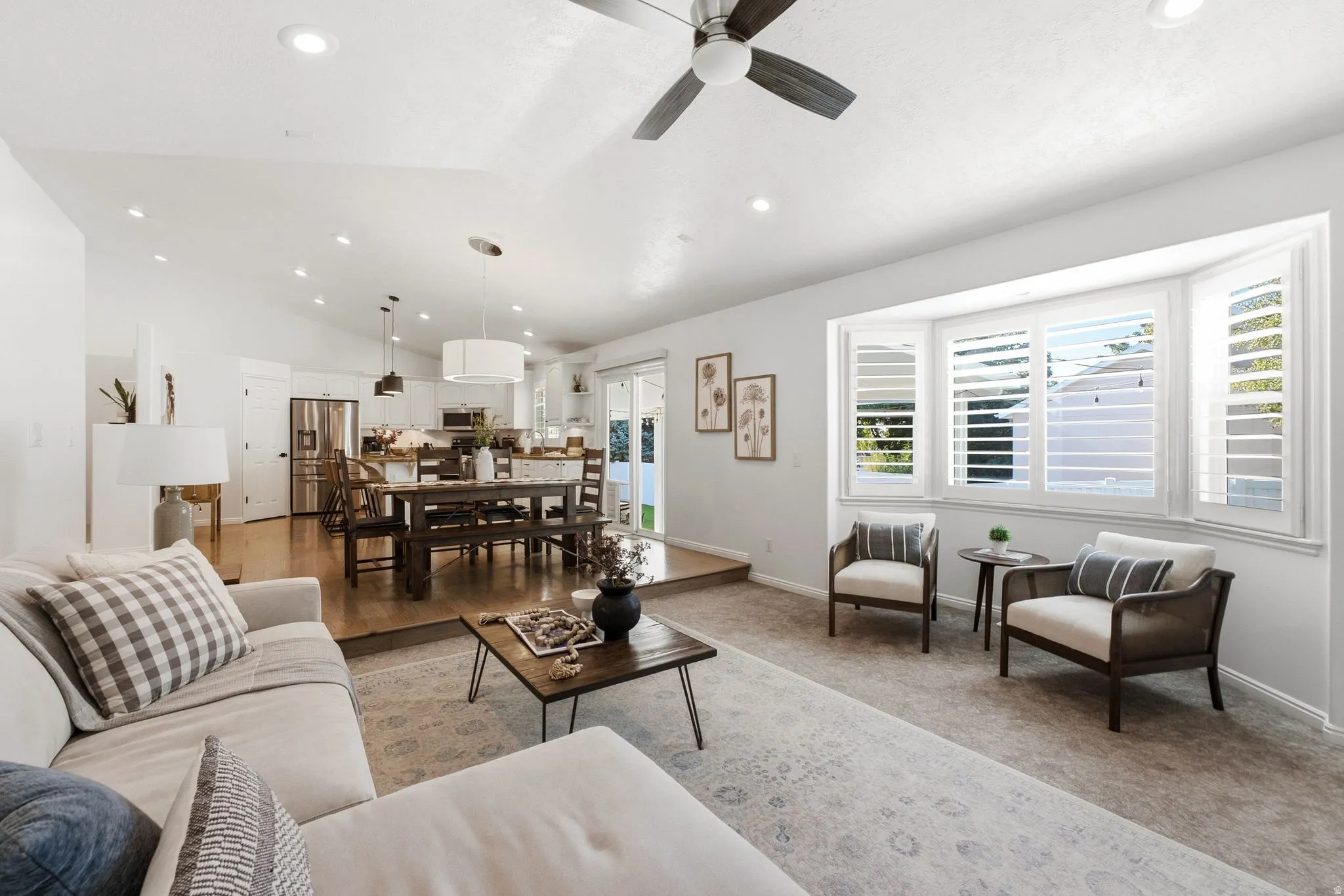 Vaulted ceiling with recessed lighting and ceiling fan