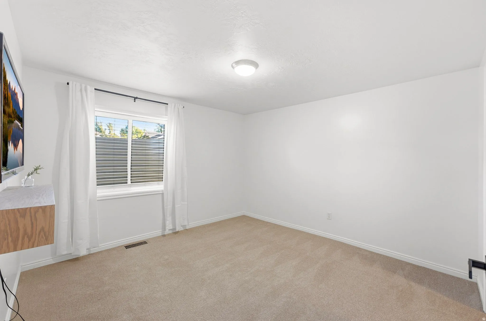 Neutral-toned carpeting throughout