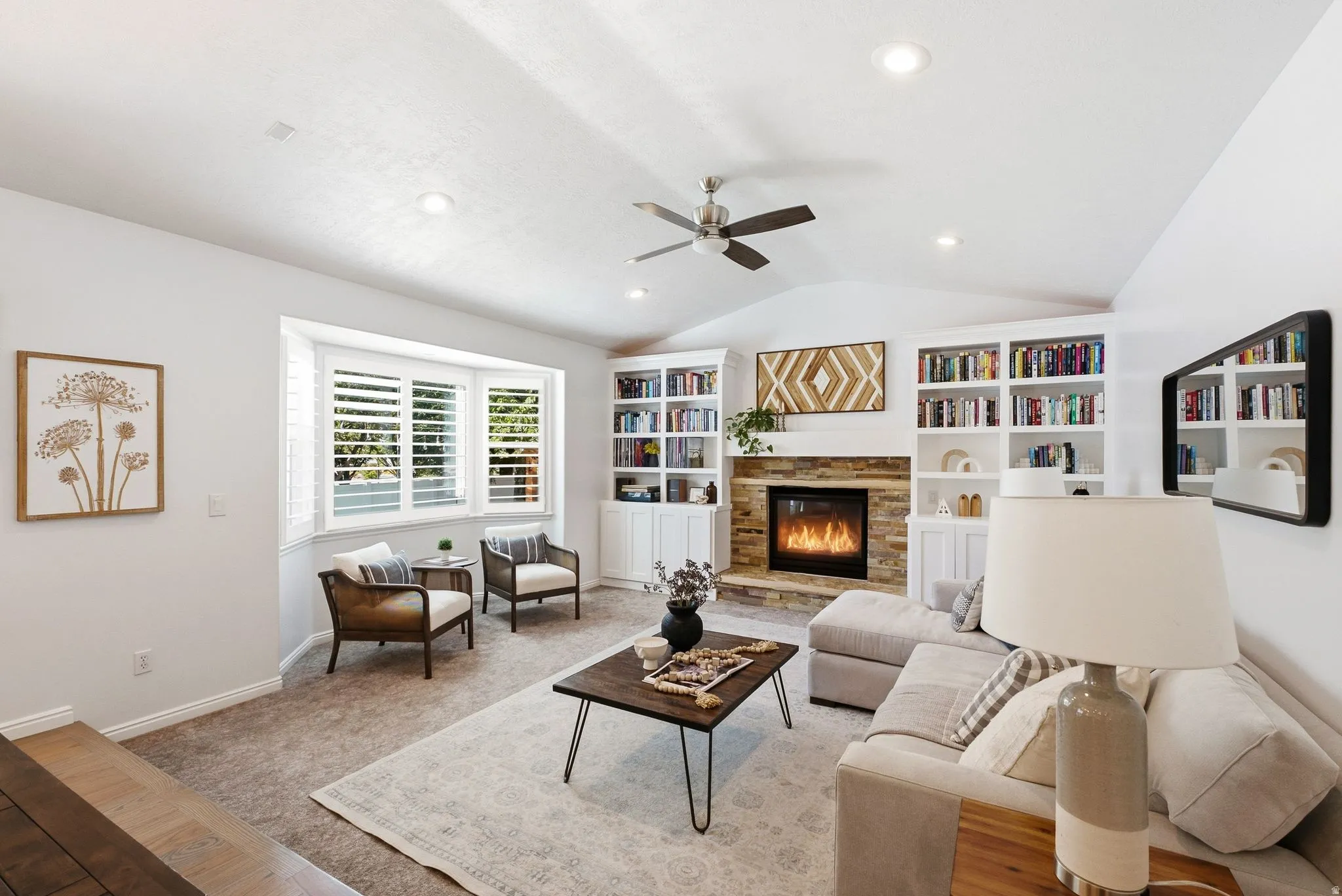 Vaulted ceiling with recessed lighting and ceiling fan