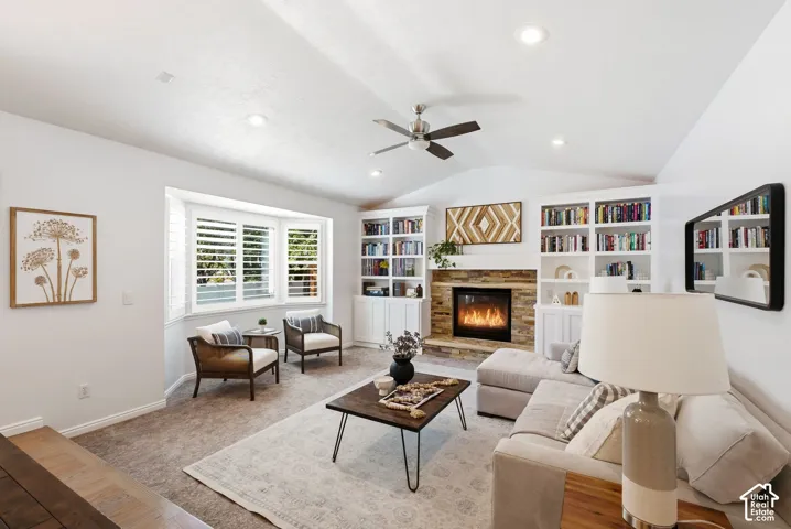 Vaulted ceiling with recessed lighting and ceiling fan