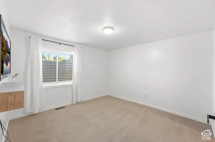 Neutral-toned carpeting throughout