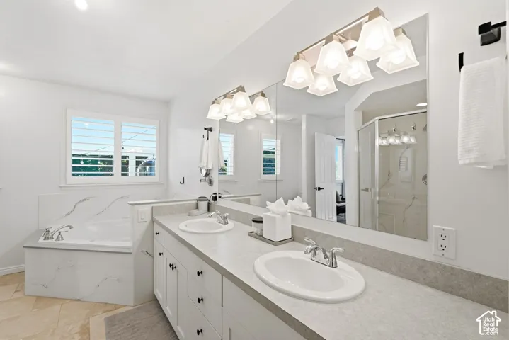 Dual vanity with undermount sinks and light-toned countertops