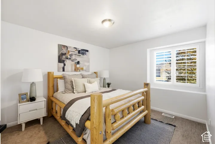 Bright room with neutral wall color and carpet flooring