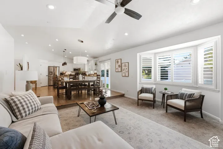 Vaulted ceiling with recessed lighting and ceiling fan