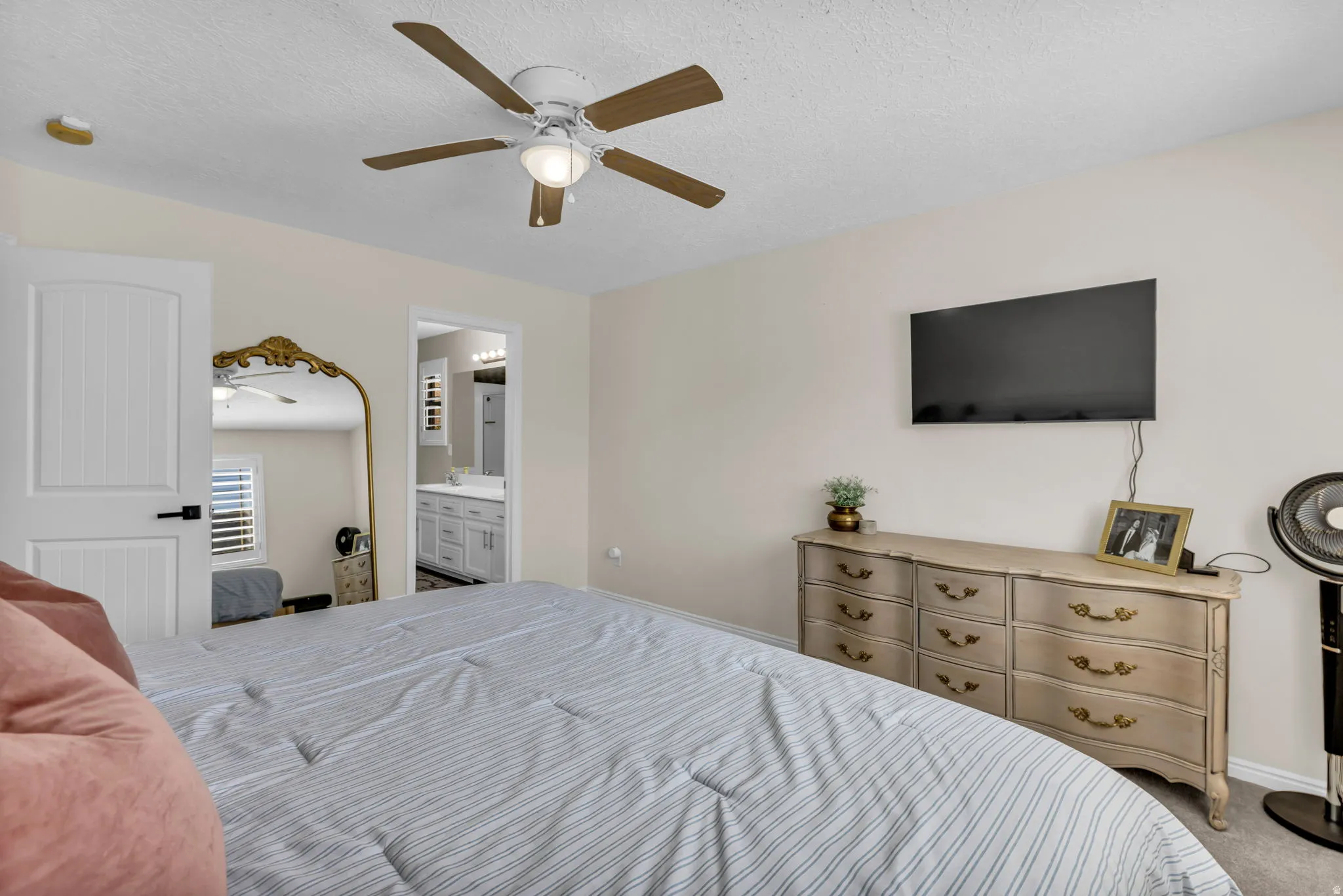 Master bedroom with plantation shutters and en-suite