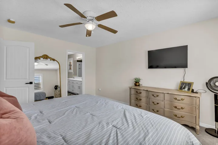 Master bedroom with plantation shutters and en-suite