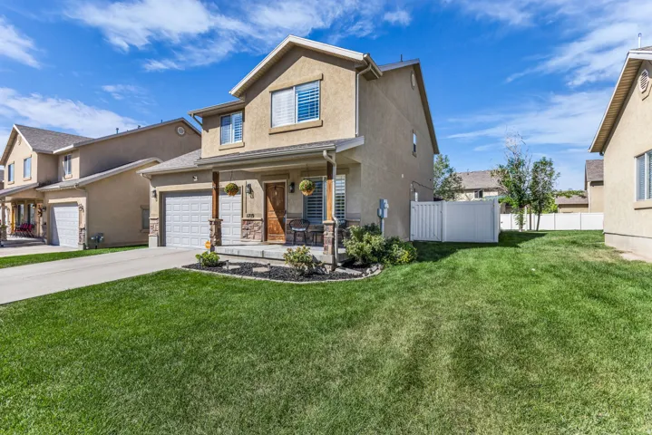 2 car garage, covered patio, HOA mows the front lawn