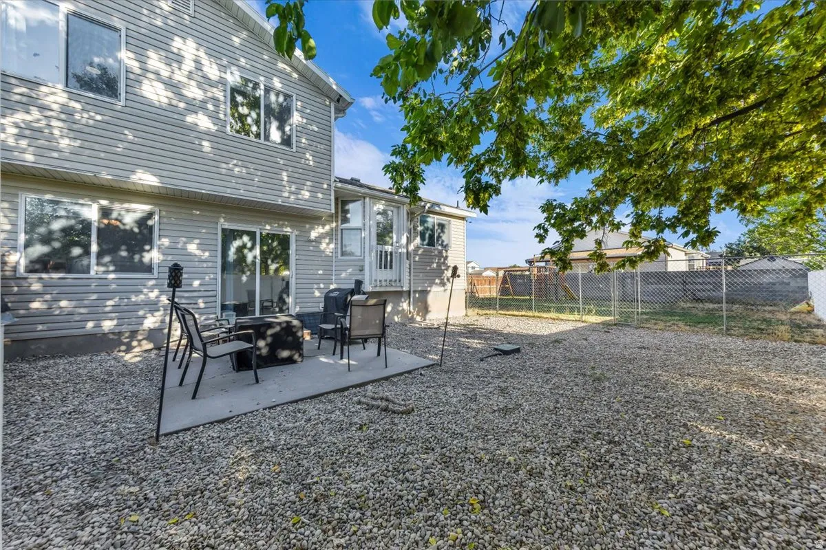 Exterior siding with multiple windows and a sliding glass door