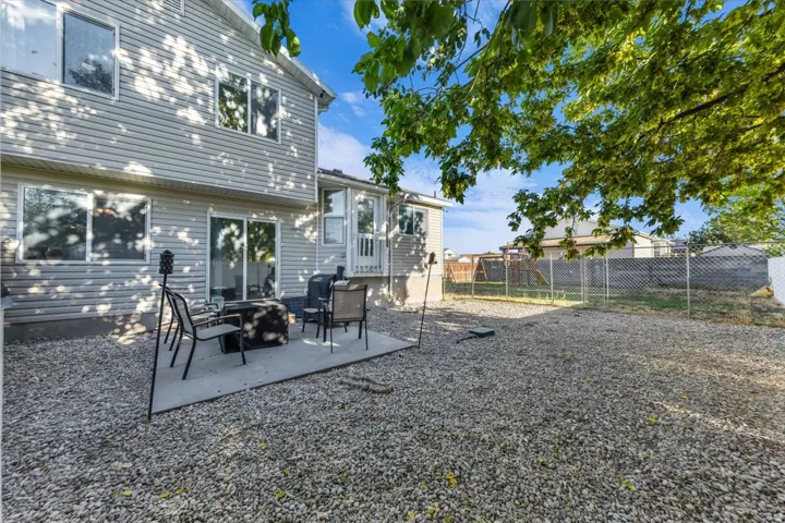 Exterior siding with multiple windows and a sliding glass door