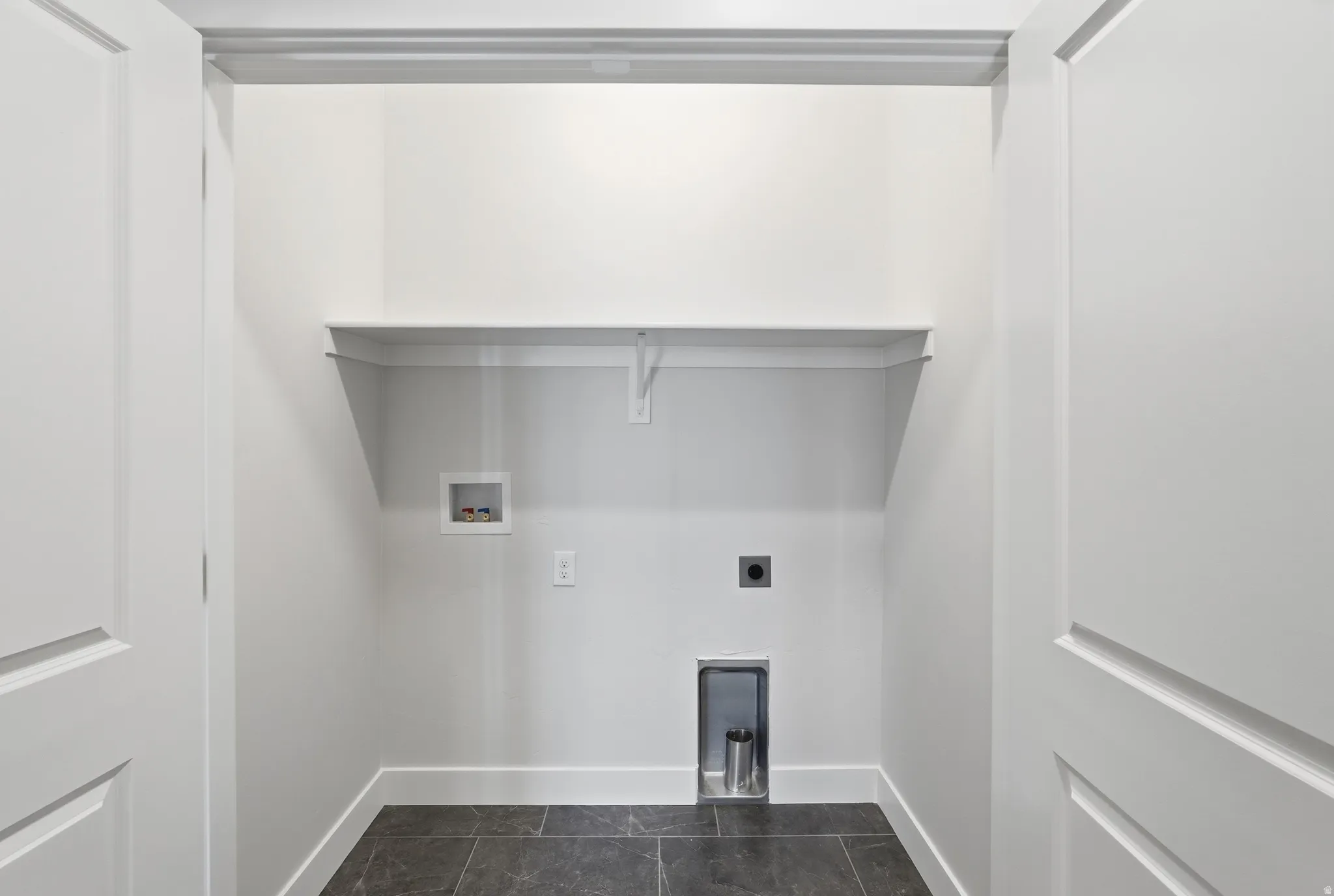 Built-in shelving, durable tile flooring, and clean white walls