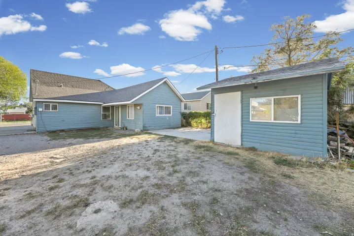 Blue siding exterior with a pitched roof