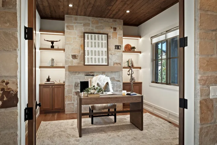 Stone fireplace with a wood-mantel and recessed hearth