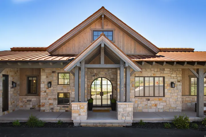 Stone veneer exterior with wood siding accents