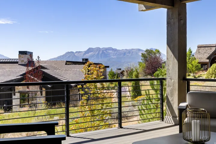 Expansive outdoor deck with cable railing and mountain backdrop