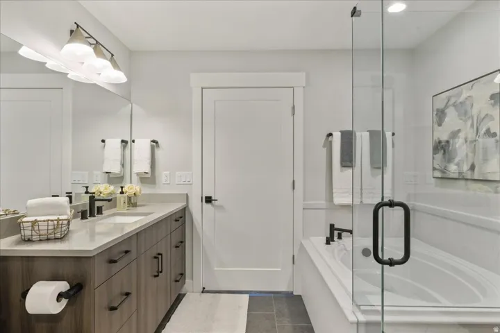 Dual-sink vanity with wood-finish cabinetry and light-toned countertop