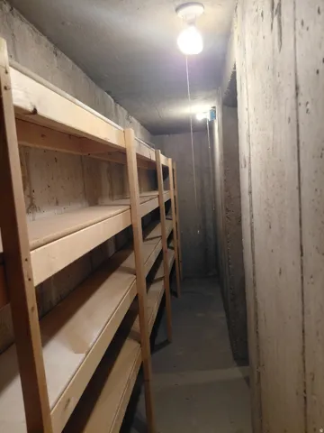 Concrete walls and ceiling with pull-chain lighting