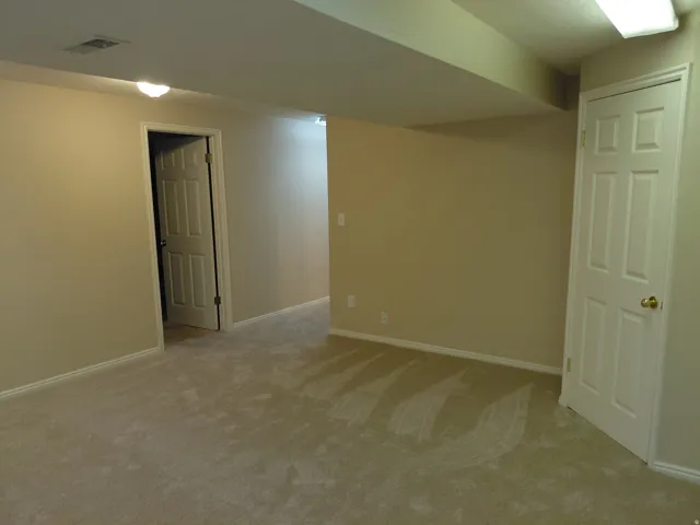 Neutral-toned carpeting throughout