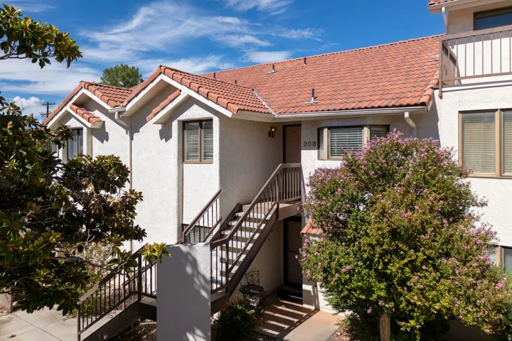 Stucco exterior with a terra cotta tile roof