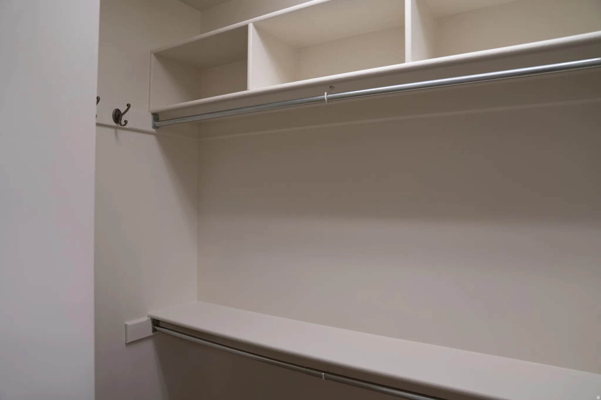 Built-in closet system featuring multiple shelves and hanging rods