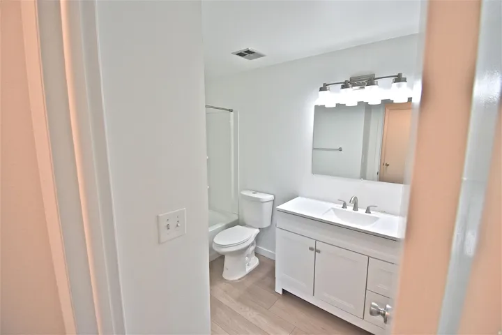 Upstairs full bath with new vanity, fixtures and lighting