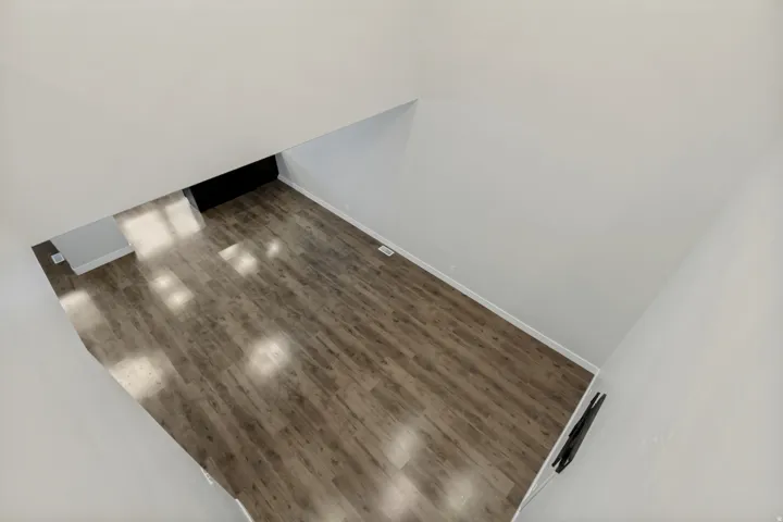 Wood-finish flooring with white wall finishes
