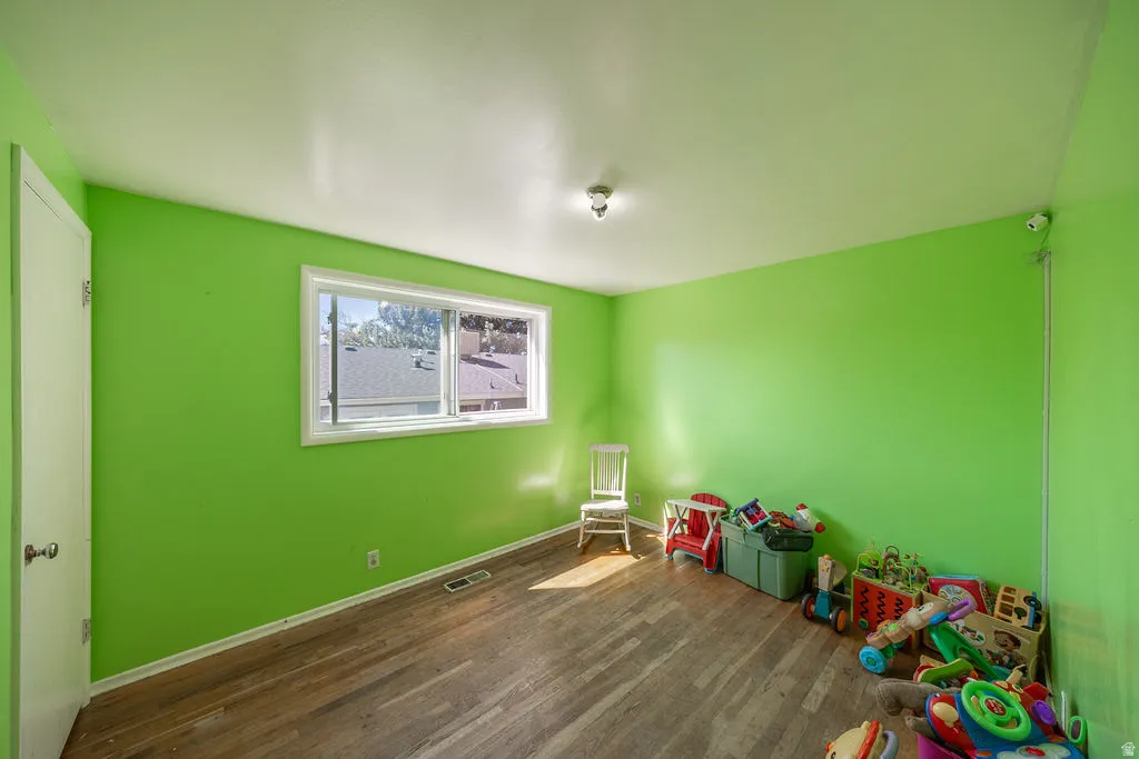 Wood-finish flooring with a window offering natural illumination