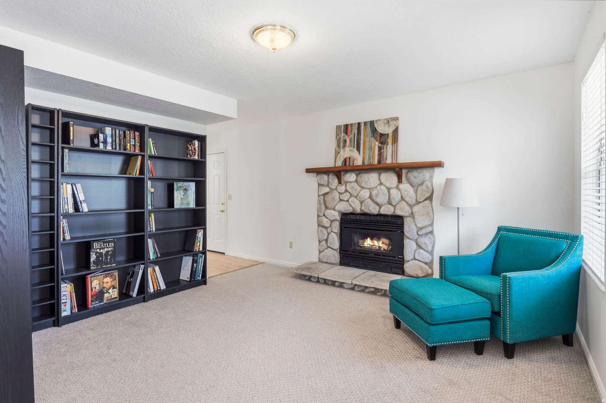 Stone-surround fireplace with a wood mantle