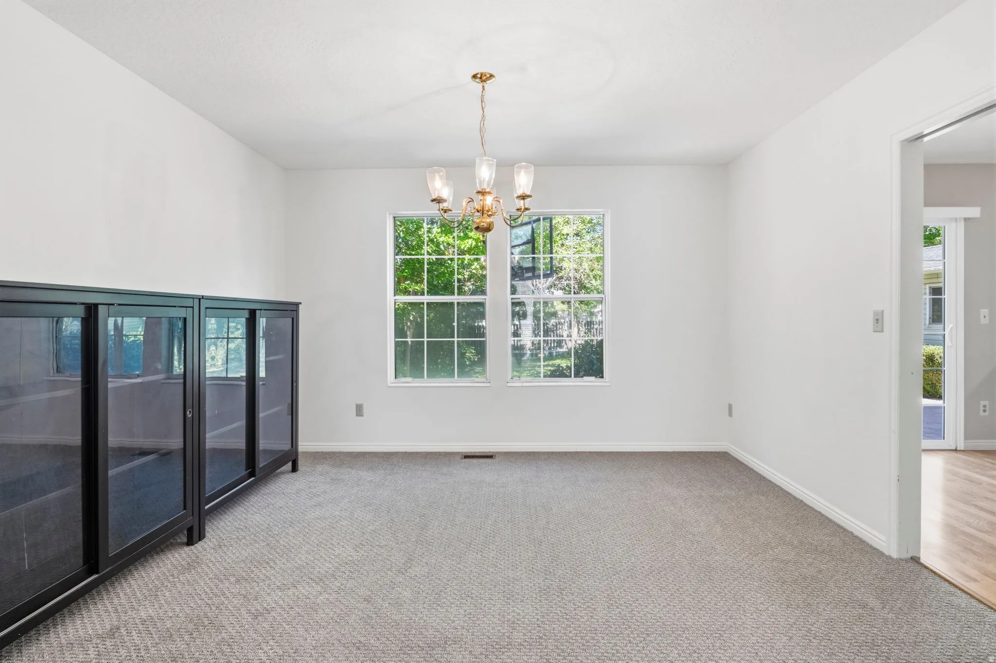 Neutral wall finishes, recessed window, and a built-in light fixture