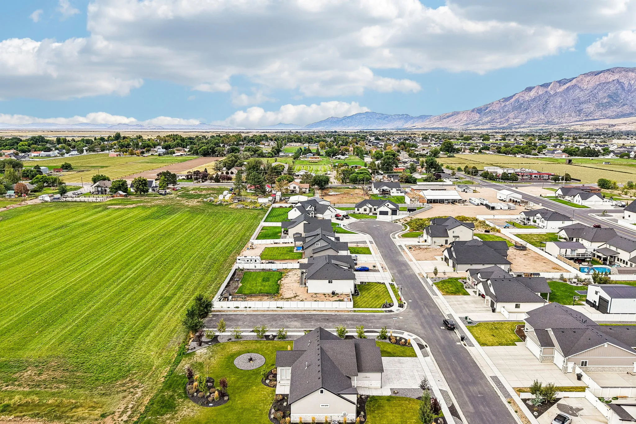 Residential neighborhood featuring newly constructed homes, paved streets, and landscaped yards