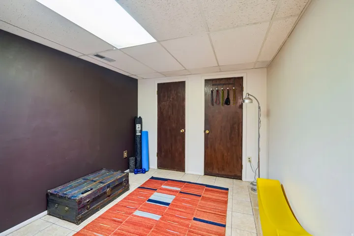 White acoustic panel ceiling with recessed lighting