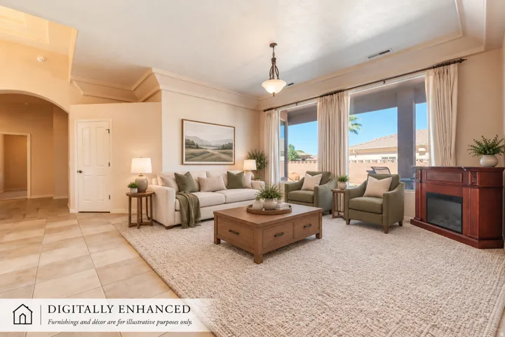 Tray ceiling details, tiled flooring, arched doorway, and large windows