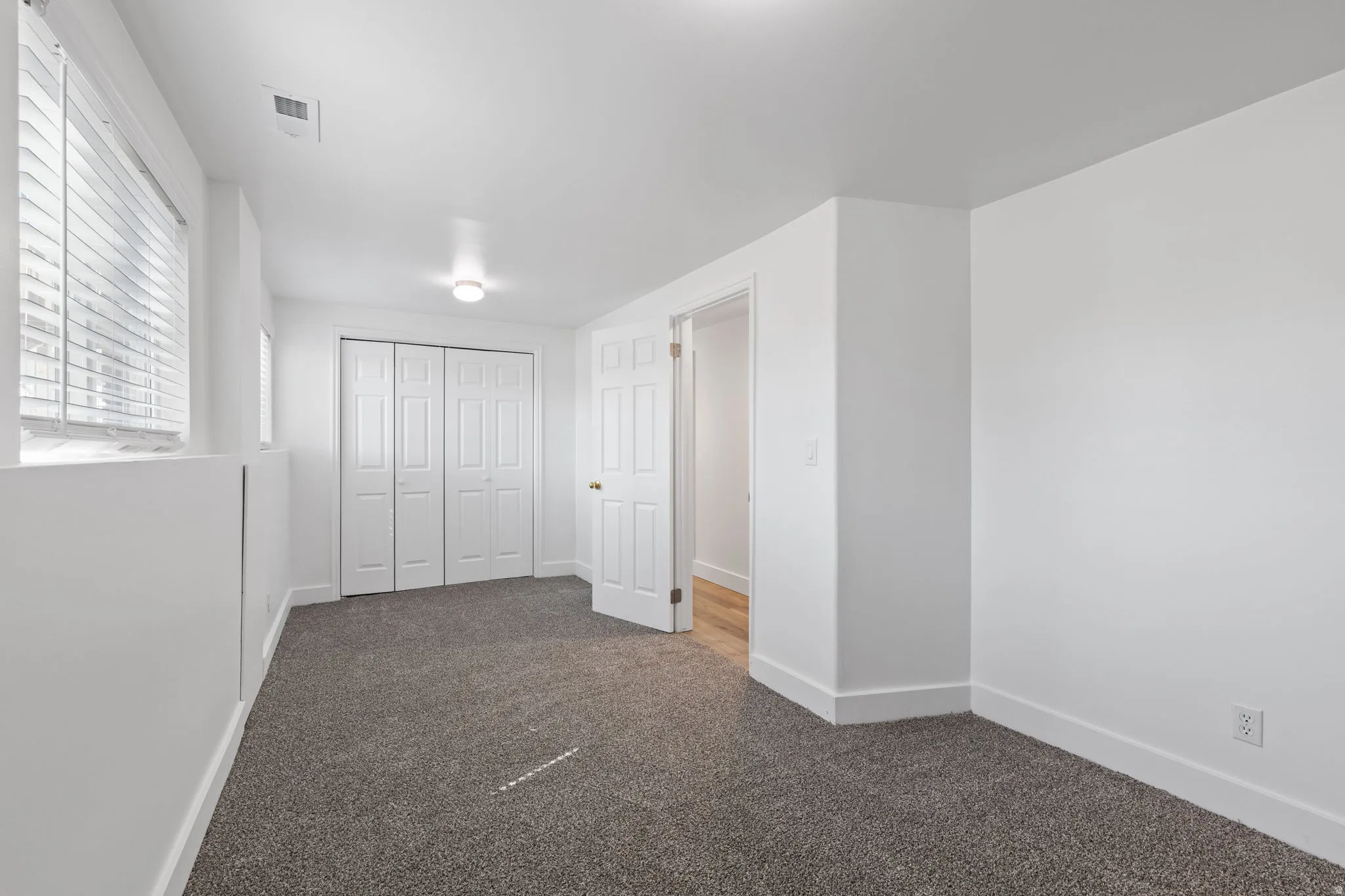 Plush carpet flooring complemented by white walls