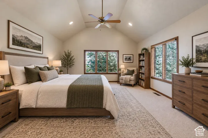 Virtually staged primary bedroom with door out to back deck