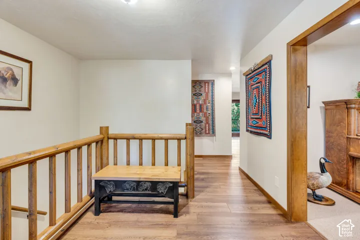 From front door. Left: office, stairs to basement. Straight to kitchen and hallway; Right, formal living room that connects to great room
