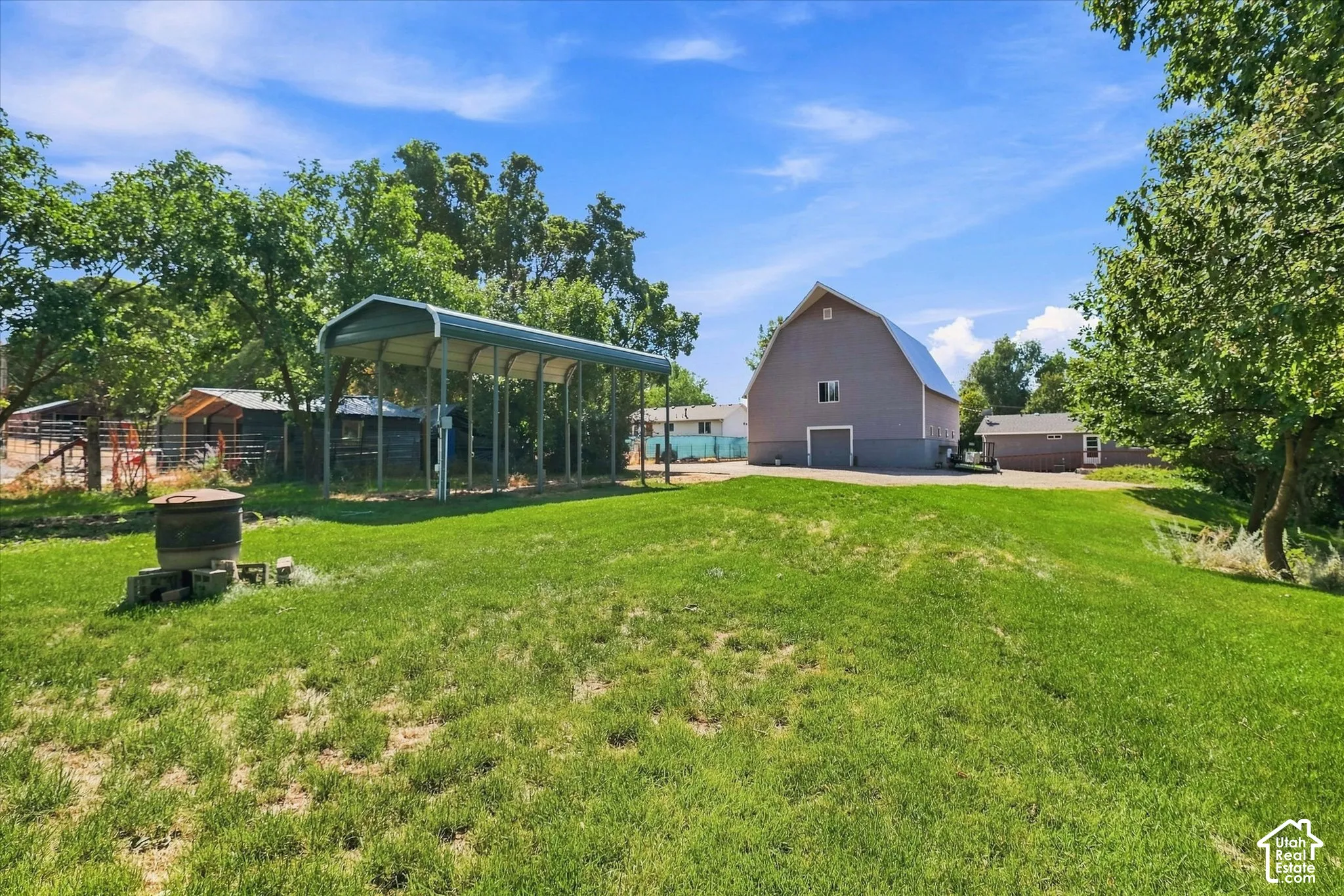 View from the north of the property looking south towards the barn and the house