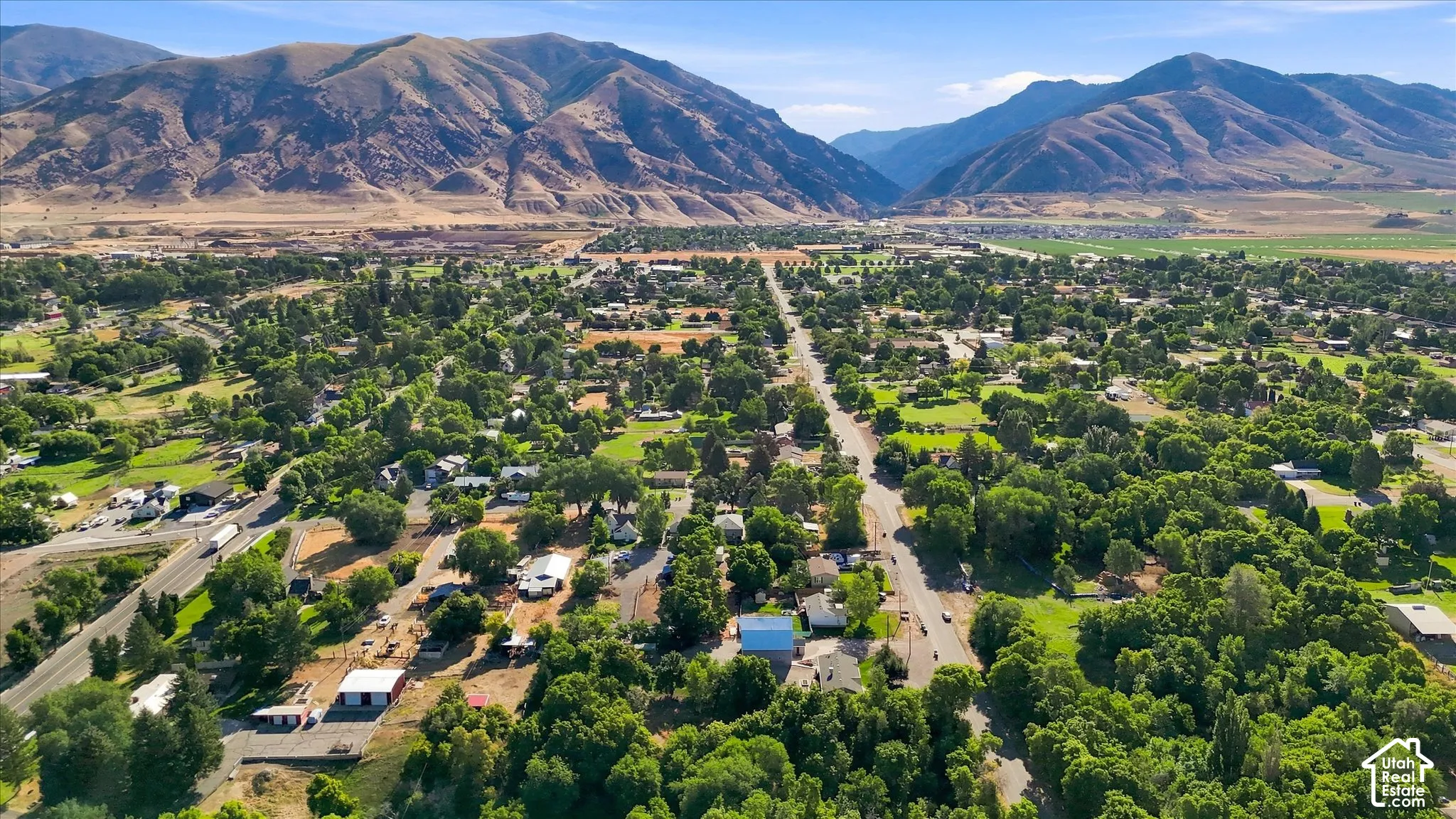 Expansive community surrounded by natural mountain landscape looking East