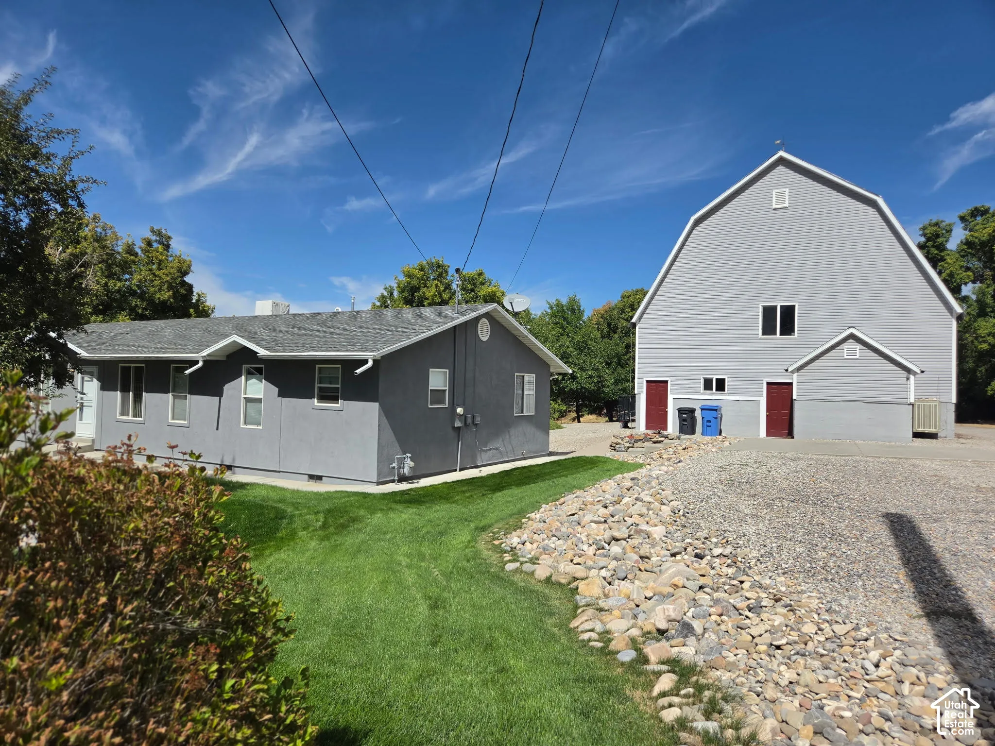 Fabulous two-story 1940's barn with a gambrel roof and a single-level living home.
