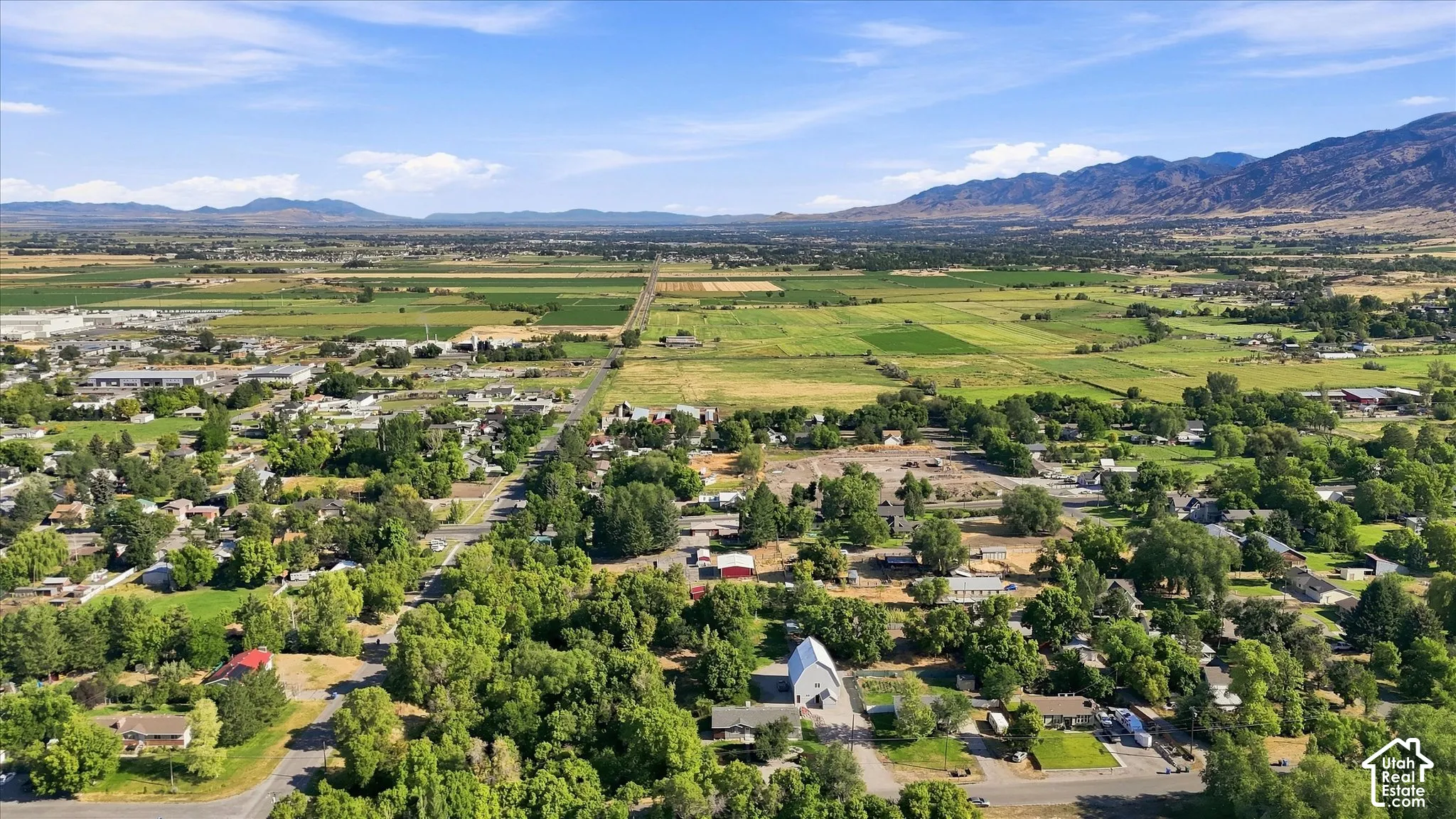 Expansive landscape featuring distant mountains to the south