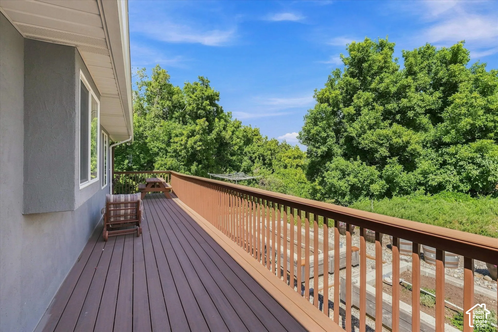 Expansive outdoor deck with composite decking, brown railing