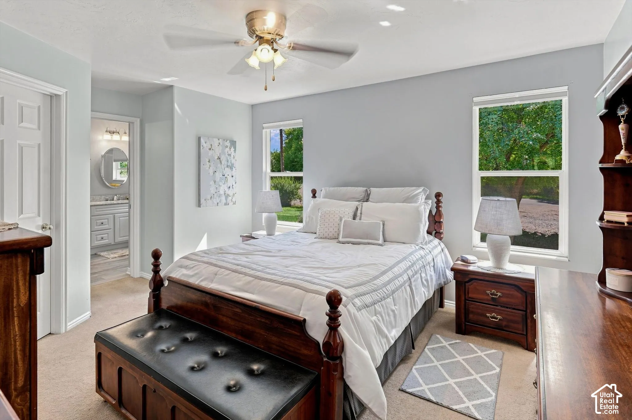 Ceiling fan with integrated lighting, two windows with natural light