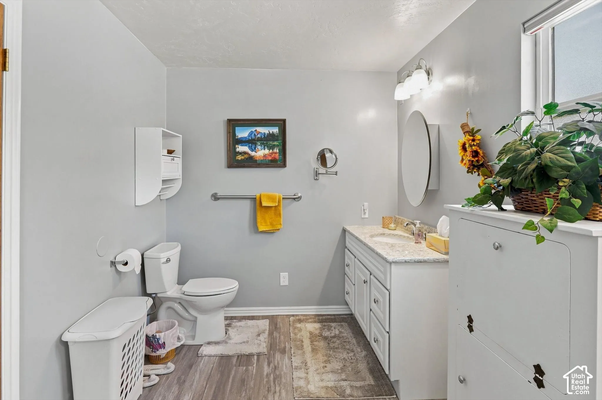 Bathroom featuring light-colored countertop, and a built-in storage cabinet